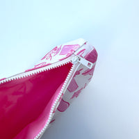 pink lining interior of makeup bag