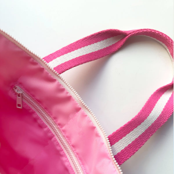 close up of pink lining and interior zipper of mini tote bar